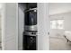 Efficient laundry closet with stacked washer and dryer unit, offering space-saving convenience at 4922 S Rifle Ct, Aurora, CO 80015