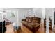 Inviting living room with hardwood floors, a plush sofa, and bright, airy ambiance at 4922 S Rifle Ct, Aurora, CO 80015