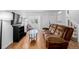 Bright living room with hardwood floors, a comfortable sofa, and ample natural light at 4922 S Rifle Ct, Aurora, CO 80015