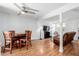 Open living and dining space featuring hardwood floors, comfortable seating, and a dining area at 4922 S Rifle Ct, Aurora, CO 80015