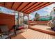 Outdoor patio featuring a covered dining area with a bench, perfect for outdoor entertaining at 4922 S Rifle Ct, Aurora, CO 80015