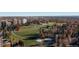 Scenic aerial view of Cheesman Park, showcasing walking paths, trees, and distant downtown skyline at 1310 N Corona St # A, Denver, CO 80218