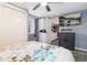 Cozy bedroom with a view of the laundry area, integrated kitchen and sleek black cabinet at 1310 N Corona St # A, Denver, CO 80218