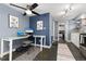 Contemporary home office space with a desk, computer setup, and kitchen access, optimized for productivity at 1310 N Corona St # A, Denver, CO 80218