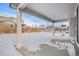 Covered patio overlooks a snow-covered backyard at 24281 E 40Th Ave, Aurora, CO 80019