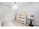 Charming Bedroom featuring a crib and stylish decor at 24281 E 40Th Ave, Aurora, CO 80019