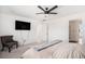 Main bedroom with king bed, ceiling fan and access to bathroom at 24281 E 40Th Ave, Aurora, CO 80019