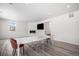 Bright dining area with white table, modern chairs, and fireplace at 24281 E 40Th Ave, Aurora, CO 80019