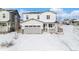 Two-story house with gray siding, double garage, and covered porch at 24281 E 40Th Ave, Aurora, CO 80019