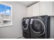 Laundry room with side-by-side washer and dryer, and window at 24281 E 40Th Ave, Aurora, CO 80019