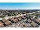 Panoramic aerial view of a residential community, showcasing its layout, community pool, and proximity to a highway at 4648 S Abilene Cir, Aurora, CO 80015