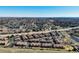 Wide aerial view of a neighborhood showcasing well-maintained homes, landscaping, and access to a nearby highway at 4648 S Abilene Cir, Aurora, CO 80015