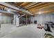 Unfinished basement featuring concrete walls, exposed wood ceiling and plumbing and mechanicals at 4648 S Abilene Cir, Aurora, CO 80015