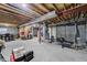 Spacious unfinished basement showing utilities, exposed ceiling, and potential for customization at 4648 S Abilene Cir, Aurora, CO 80015