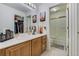 Well-lit bathroom with a vanity, decorative Eiffel Tower accents, and a closet full of shoes at 4648 S Abilene Cir, Aurora, CO 80015