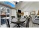 Open floor plan with dining area connects to living area at 4648 S Abilene Cir, Aurora, CO 80015