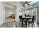 Dining area with slider to outdoor, seamlessly connects to the living spaces at 4648 S Abilene Cir, Aurora, CO 80015