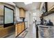 Functional kitchen area with stainless steel appliances and granite countertops at 4648 S Abilene Cir, Aurora, CO 80015