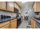 Efficient kitchen design with modern appliances and granite countertops at 4648 S Abilene Cir, Aurora, CO 80015