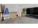 Upstairs living area with a television, decorative decor, and a bright window at 4648 S Abilene Cir, Aurora, CO 80015