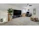 Spacious upper living room with a large TV, desk area, and comfortable seating, perfect for relaxing at 4648 S Abilene Cir, Aurora, CO 80015