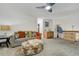 Inviting living area with a cozy couch, colorful pillows, and ottoman, perfect for relaxation at 4648 S Abilene Cir, Aurora, CO 80015