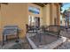 Outdoor patio with dining set, grill, and sliding glass door entrance at 4648 S Abilene Cir, Aurora, CO 80015