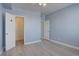 Another view of the spacious bedroom with light hardwood floors at 12914 Ironstone Way # 201, Parker, CO 80134