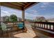 Covered patio with chairs and views of the surrounding neighborhood at 12914 Ironstone Way # 201, Parker, CO 80134