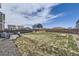 Expansive backyard with a patio, garden area, and ample space for outdoor activities at 27425 E Byers Pl, Aurora, CO 80018