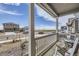 Inviting front porch with seating, offering a pleasant view of the street and surrounding neighborhood at 27425 E Byers Pl, Aurora, CO 80018