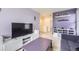 Entertainment space with a large TV, comfortable seating, and playful decor at 27425 E Byers Pl, Aurora, CO 80018