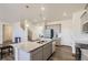 Bright kitchen with an island, granite countertops, stainless steel appliances, and ample cabinet space at 27425 E Byers Pl, Aurora, CO 80018