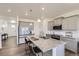 Modern kitchen featuring granite countertops, an island with seating, and stainless steel appliances at 27425 E Byers Pl, Aurora, CO 80018