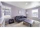 Inviting living room features natural light, a comfortable sofa, and modern decor at 27425 E Byers Pl, Aurora, CO 80018
