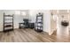 A home office area with a modern desk, chair, and shelving, creating a functional and stylish workspace at 27425 E Byers Pl, Aurora, CO 80018