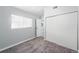 Simple bedroom with grey carpet and closet at 14396 E Florida Ave # B, Aurora, CO 80012