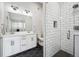 Bathroom with white double vanity and hexagon tile floor at 2054 S Xenia Way # 59, Denver, CO 80231