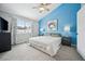 Spacious bedroom with a king-size bed and blue accent wall at 2054 S Xenia Way # 59, Denver, CO 80231