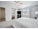 Main bedroom with sliding barn door to en-suite bathroom at 2054 S Xenia Way # 59, Denver, CO 80231