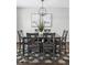 Modern dining room with a gray table and chairs and stylish rug at 2054 S Xenia Way # 59, Denver, CO 80231