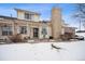 Attractive exterior of a two-story townhome with snow-covered landscaping at 2054 S Xenia Way # 59, Denver, CO 80231