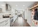 Modern white kitchen with stainless steel appliances and hardwood floors at 2054 S Xenia Way # 59, Denver, CO 80231