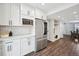 Modern kitchen with stainless steel refrigerator and white shaker cabinets at 2054 S Xenia Way # 59, Denver, CO 80231