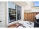 Small patio with snow on the ground and sliding glass door access at 2054 S Xenia Way # 59, Denver, CO 80231