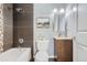Modern bathroom featuring a bathtub, shower, and vanity with great lighting at 1388 Kenton, Aurora, CO 80010