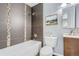 Modern bathroom featuring a bathtub, shower, and vanity with great lighting at 1388 Kenton, Aurora, CO 80010