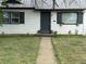 Charming home exterior with front lawn, walkway, inviting entryway, and window flower boxes at 1388 Kenton, Aurora, CO 80010