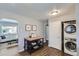 The laundry area features modern washer and dryer units close to the kitchen at 1388 Kenton, Aurora, CO 80010