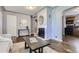 The living room features hardwood floors, natural light, and a decorative fireplace at 1388 Kenton, Aurora, CO 80010